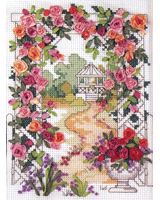 This arbor is adorned with beautiful silk ribbon roses.