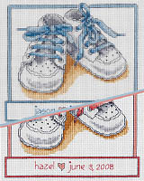 Have a hand-crafted record of your baby's birth. These cute baby shoes come in pink or blue, naturally. Counted Cross Stitch design by Linda Gillum