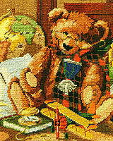 Heirloom Teddy Bear with glasses, war medal, and tartan scarf, is the focal point in this attic of treasures. This needlepoint design is rich in color and imagery and is the perfect design for bear or aviation lovers.