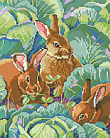 Three bunny’s nibbling clover peek out from the cabbage patch in this realistic and elegant Bunny’s Cabbage Garden design by designer Linda Gillum.