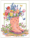Spring Rainboots - PDF: This cheerful scene depicts cute rain boots bursting with colorful tulips, lavender and daffodils in a beautiful garden after a Spring rain. Little butterflies are flitting about to soak up the sun. This charming scene makes you feel like you've just come in from a gardening session in springtime. 