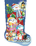Winter Fun Stocking - PDF: Our cheerful snow family is glowing in the light of a candlelit lantern on a cold dark winters evening.