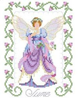 Peace is reflected in our June fairy. A white dove rests on one hand and in the other; she holds a pink rose, the flower of the month of June. One in a series of twelve faeries.