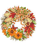 A Wreath For Fall - PDF: This sweet wreath full of warm fall foliage and corn is one of four seasonal wreaths that look perfect together stitched on a pillow or in a long line in a frame. Collect all four.